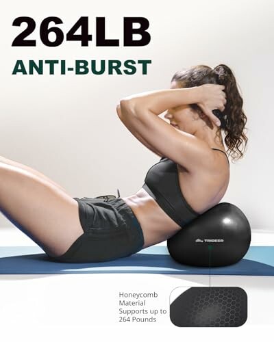 Woman using an anti-burst exercise ball for sit-ups.