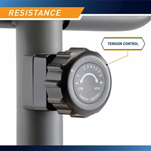 Close-up of exercise bike tension control knob with resistance levels.