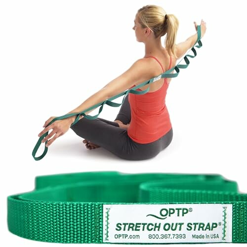 Woman stretching with a green strap